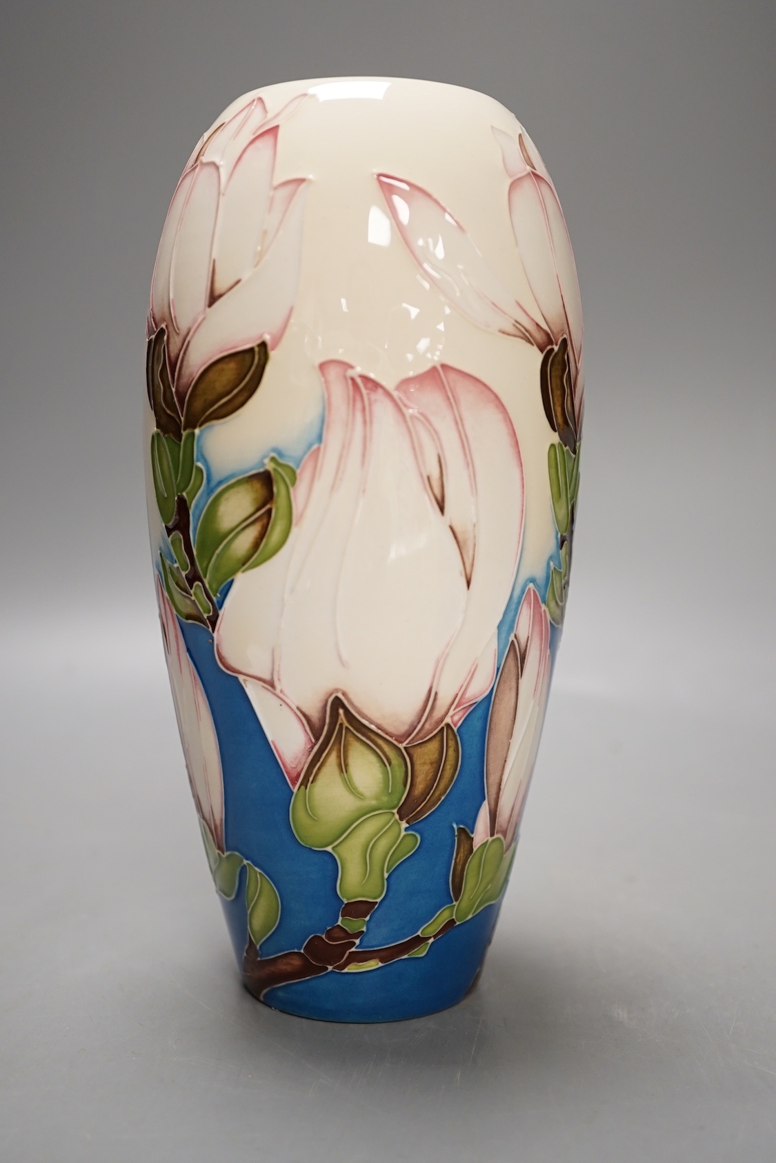 A Moorcroft 'sunshine magnolia' vase by Paul Hilditch, limited edition 10/100, 2011, boxed, 18.5 cms high.